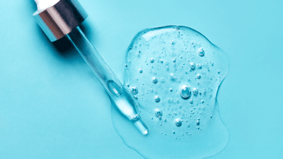 Hyaluronic acid substance and syringe on a table.