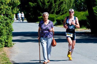 People walking and exercising in a park