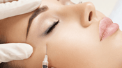 A female patient receiving Belotero treatment for under eyes in a clinic.