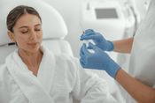 Beautiful healthy smiling caucasian woman is getting a Dermalax fillers procedure
