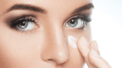 A photo showing woman applying skin care after Belotero filler treatment.