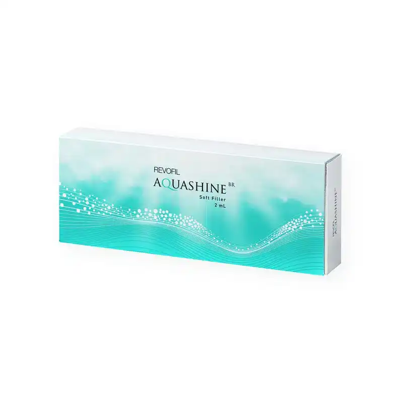 A product box labeled "REVOFIL AQUASHINE SOFT FILLER - 2 Pre-Filled Syringes". The packaging is primarily white and teal, with a wave design and dotted patterns across the front.