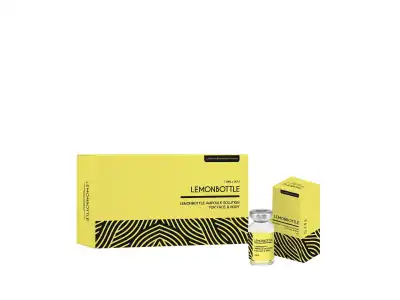 Image of LEMONBOTTLE AMPOULE SOLUTION 10ml skincare packaging. The packaging is bright yellow with the brand name "Lemonbottle" and the product description "LEMONBOTTLE AMPOULE SOLUTION 10ml" printed on it. The packaging also features a black zigzag pattern at the bottom.