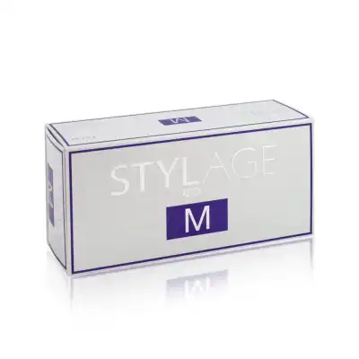 A rectangular box of STYLAGE® M gel filler against a white background. The box is predominantly white with purple detailing and text, featuring the word "STYLAGE" and the letter "M" prominently on the front.