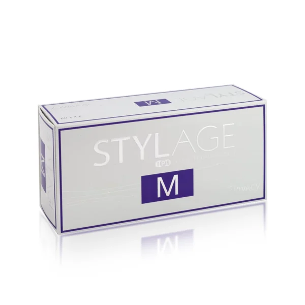 A rectangular box of STYLAGE® M gel filler against a white background. The box is predominantly white with purple detailing and text, featuring the word "STYLAGE" and the letter "M" prominently on the front.