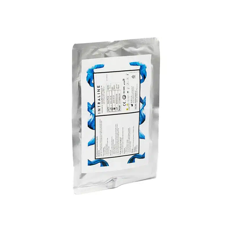 A silver metallic medical packaging is shown with a white label featuring blue patterns on the