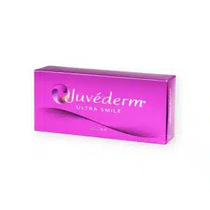 A pink rectangular box of JUVÉDERM® ULTRA SMILE is shown. The packaging has a gradient design with the Juvéderm logo, consisting of a curved line and a gradient sphere, and the text "ULTRA SMILE" printed below it.