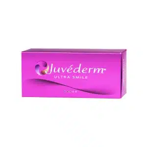 A rectangular, bright pink box displaying the product name "JUVÉDERM® ULTRA SMILE" in white text with a curved design element. The box features the brand logo in the top left corner.