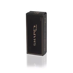 A sleek black rectangular box with gold accents and text that reads "REVANESSE® SHAPE+™ with Lidocaine" is standing upright. The brand name "REVANESSE" is printed vertically on the side of the box. The box casts a slight reflection on the white surface it is placed on.