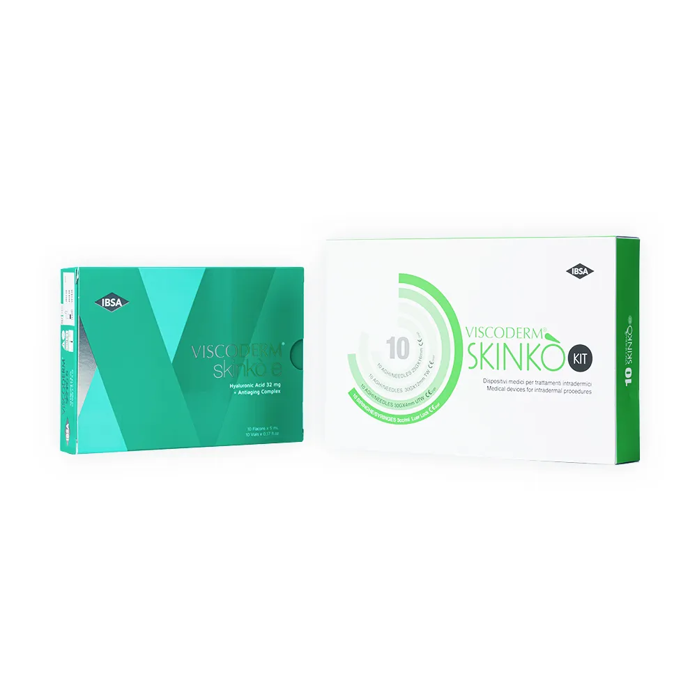 Two green and white boxes labeled “VISCODERM® SKINKÒ E” and “VISCODERM® SKINKÒ KIT” sit side by side against a white background, featuring clear medical or cosmetic branding.