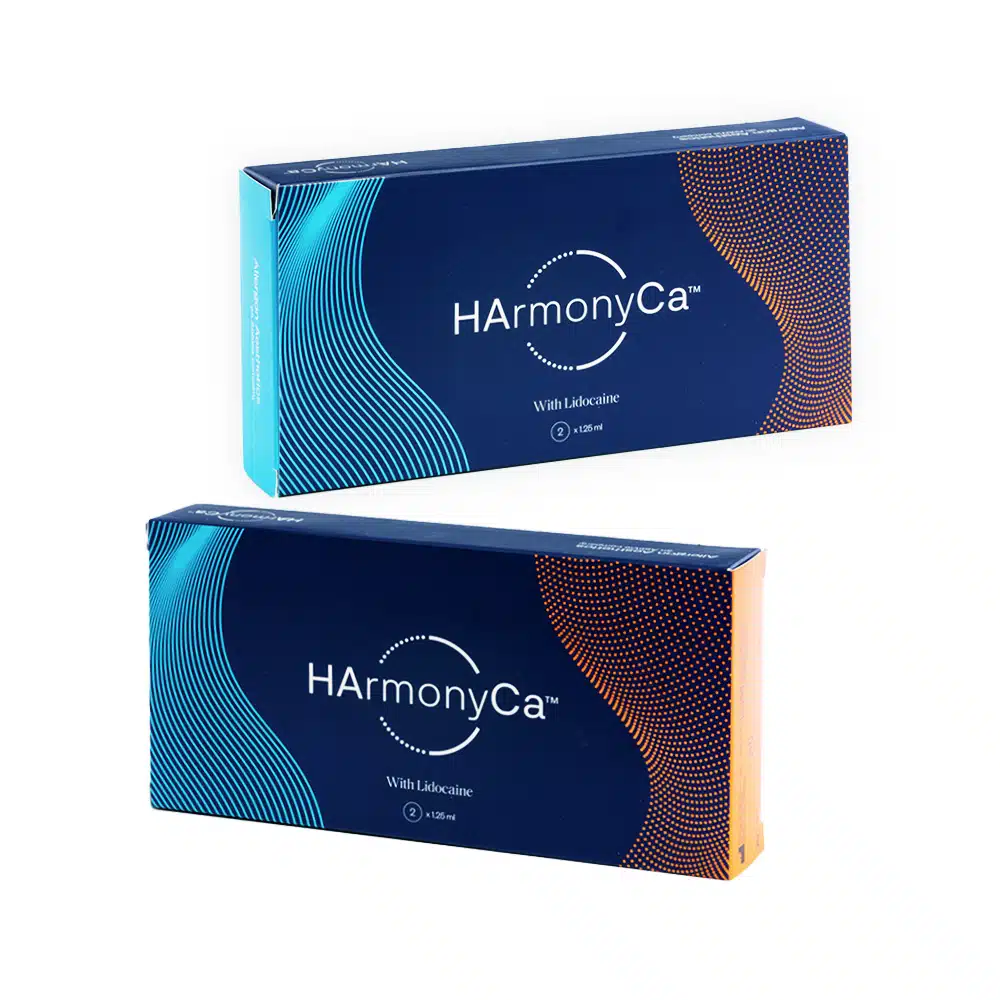 Two rectangular boxes of HArmonyCA™ with Lidocaine, featuring a white and teal design on one box