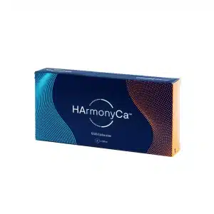 A rectangular blue box labeled "HArmonyCA™ with Lidocaine" is pictured. The box features a wavy design element on the left in light blue and on the right in orange. There is a small circular graphic in the center below the text.