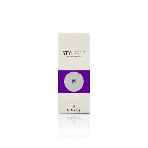 A box of STYLAGE® M BI-SOFT®, a cosmetic product from VIVACY, features a white and purple design. The packaging displays the product name at the top and a large "M" in a purple circle in the center. VIVACY's logo is at the bottom with the text "+ IPN-LIKE TECHNOLOGY" at the top.
