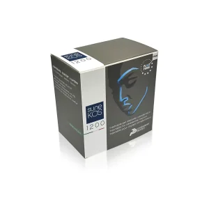 A black and gray box of SUNEKOS® 1200. The front of the box features the product name and an illustration of a woman's face in blue and white lines. Text on the left side of the box is in Italian. The box is placed on a white background.