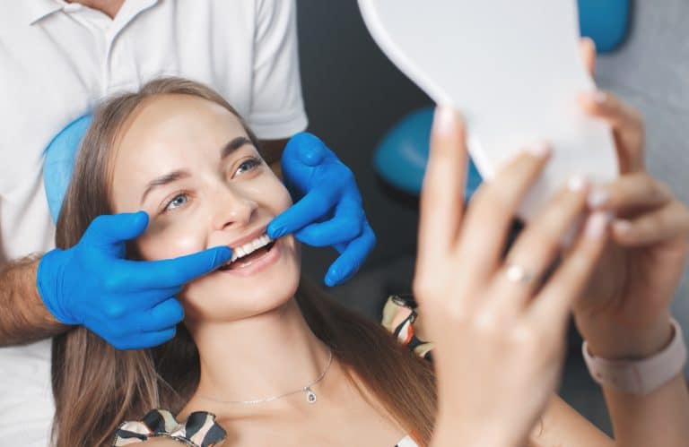 young woman getting an oral exam before veneers