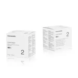 Two white boxes of MESOESTETIC® COSMELAN® 2 are displayed on a white background. Text and product details are visible on the sides of the boxes. Each box is labeled "30 g / 1.06 oz.