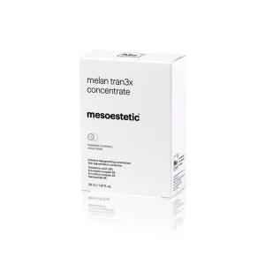 A white box standing upright labeled "MESOESTETIC® MELAN TRAN3X CONCENTRATE" from the brand "mesoestetic." The packaging includes product details such as volume (30 ml / 1.01 fl. oz.) and claims for skin pigmentation solutions. The box design is minimalistic with black text.