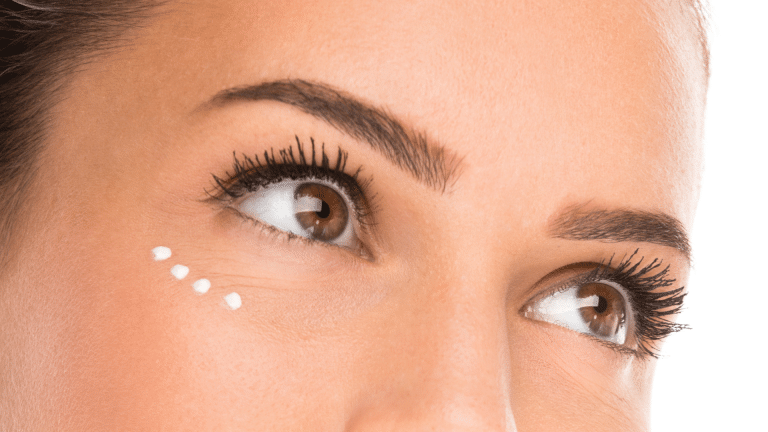Woman showcasing rejuvenated eyes after treatment.