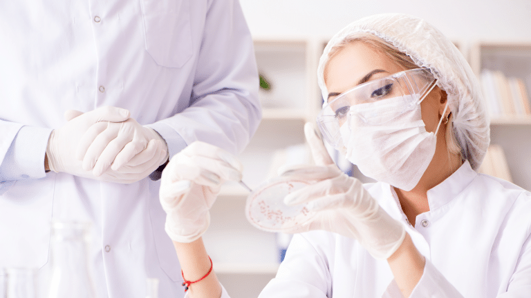 Medical professional observing chemicals in a lab.
