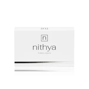 A white rectangular box with "NITHYA ENDLESS BEAUTY" written in lowercase letters in the center and "Endless beauty" beneath it. There is a black and silver horizontal line near the bottom. The top-center has a square logo with a stylized "n" inside. The background is white.