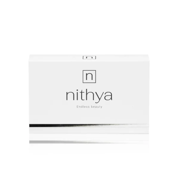 A white rectangular box with "NITHYA ENDLESS BEAUTY" written in lowercase letters in the center and "Endless beauty" beneath it. There is a black and silver horizontal line near the bottom. The top-center has a square logo with a stylized "n" inside. The background is white.