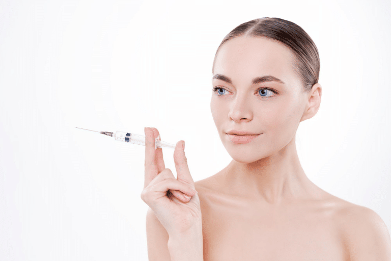 Woman examining a hyaluron filler Juvederm syringe, representing non-surgical skin rejuvenation treatments