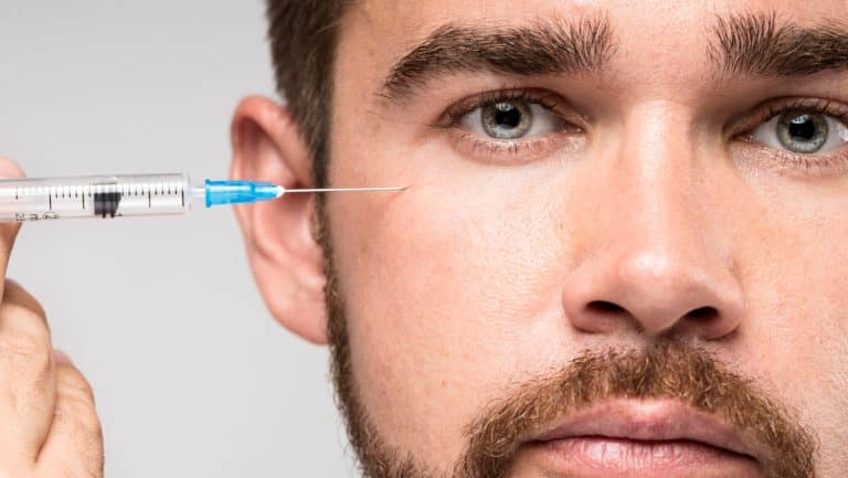 man's face injected