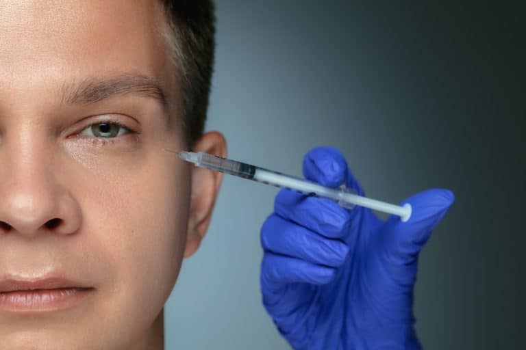 injecting man's face