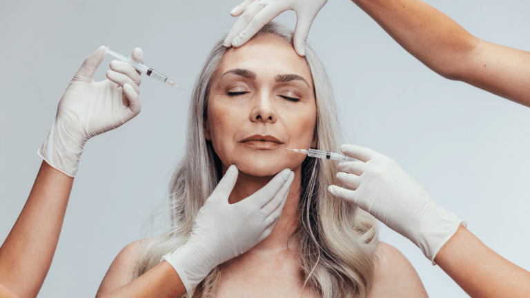 white-haired woman injected