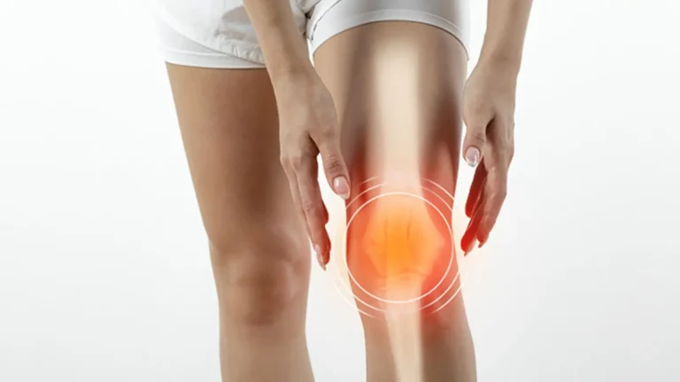 A person holding their knee, which is highlighted with a red glow and circular graphic, indicating pain or discomfort. The background is plain white.