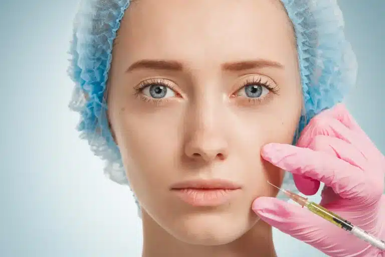 Close-up of a female patient getting dermal filler treatment.