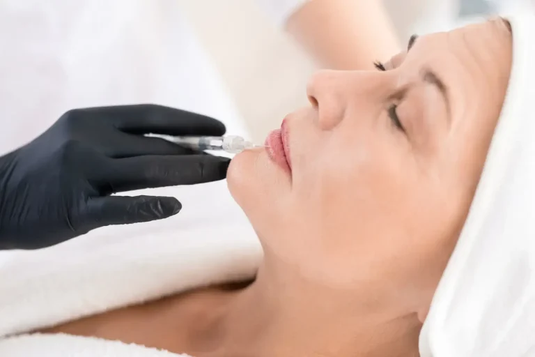 Woman getting facial injection.