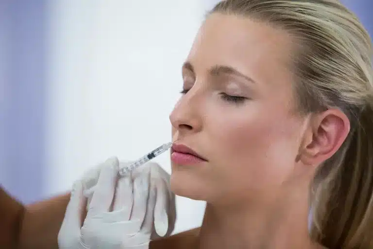 Person getting lip fillers.