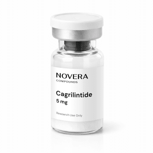 A small clear vial labeled “Cagrilintide 5mg” with a silver cap and white label, containing a white powder at the bottom, intended for research use only.