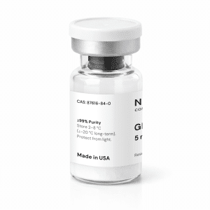 A clear glass vial with a silver cap, white label, and visible white powder inside. The label reads “GHRP-6 5mg,” “≥99% Purity,” and “Made in USA” among other text.