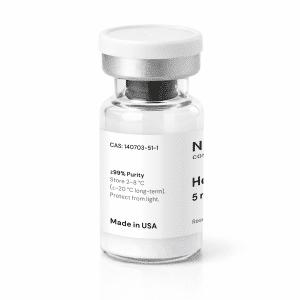 A clear glass vial with a silver cap contains a white powder labeled “Hexarelin 5mg,” marked “≥99% Purity,” storage instructions, “Made in USA,” and additional partially visible text.