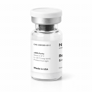 A clear glass vial with a white label and silver cap, containing white powder. The label displays the product name “Retatrutide 5mg”, “≥99% Purity,” storage instructions, “Made in USA,” and a CAS number.
