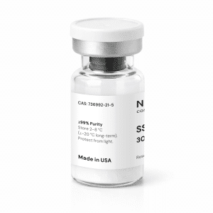 A clear glass vial with a white label and cap, displaying text including “≥99% Purity,” “CAS: 736992-21-5,” “Store 2–8°C,” and “Made in USA.” The vial contains a white powder.