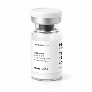 A clear glass vial with a white cap, containing a white powder. The label displays text including “TRH Thyrotropin 20mg,” “≥99% Purity,” storage instructions, and “Made in USA.”.