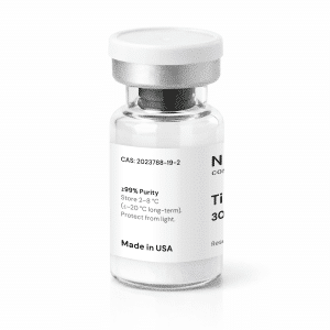 A clear glass vial with a white label and silver cap, showing chemical information, storage instructions, and “Made in USA.” The contents appear to be a pharmaceutical or laboratory substance.