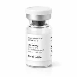 A clear glass vial with a white label and silver cap, displaying chemical information, storage instructions, and “Made in USA” text. The white powder inside is visible.