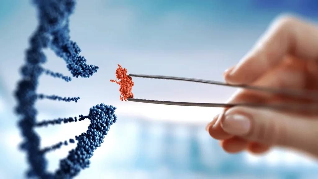 A hand uses tweezers to place a small, orange cluster of molecules into a larger, blue DNA strand.
